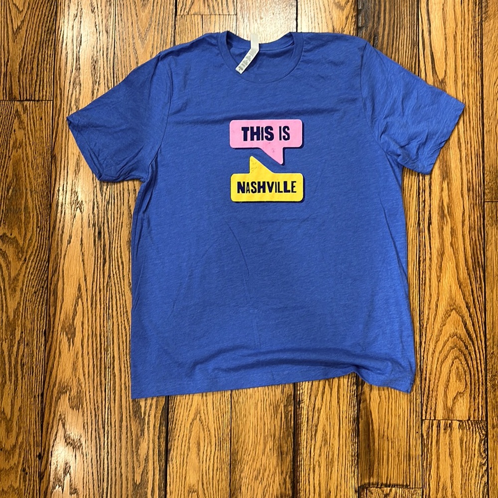 THIS IS NASHVILLE SHORT SLEEVE T-SHIRT SIZE XL IN BLUE, PINK, YELLOW AND BLACK